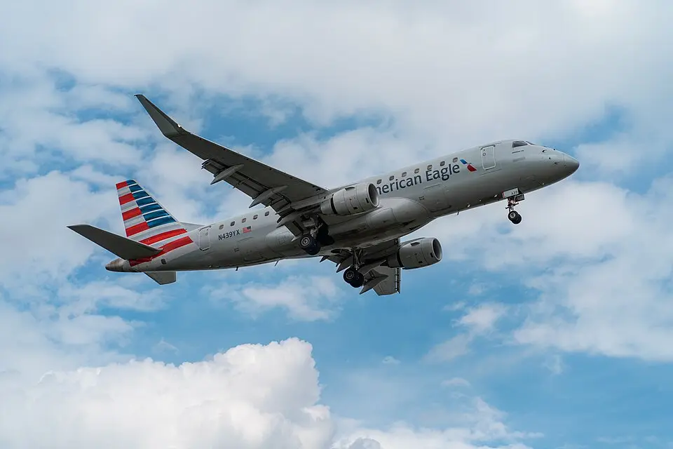 American Eagle Embraer 175 regional jet, operated by Republic Airways, climbing after takeoff