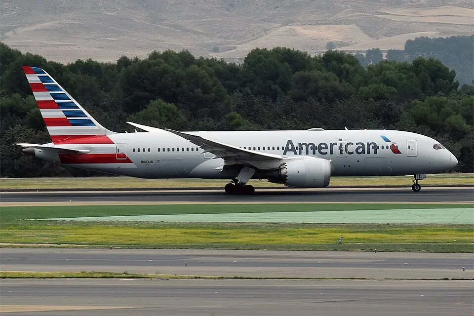 American Airlines Boeing 787 Dreamliner taxiing with hills in the background