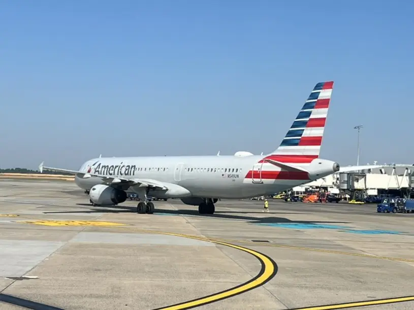 American Airlines Airbus A321 parked at the gate on a clear day